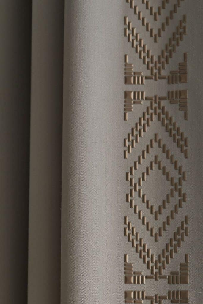 Aiveen Daly heat applied beads to curtain trim.
