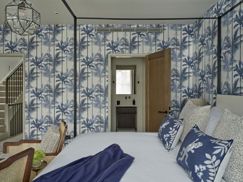 Graham and Brown Jungle Cobalt Wallpaper in bedroom.