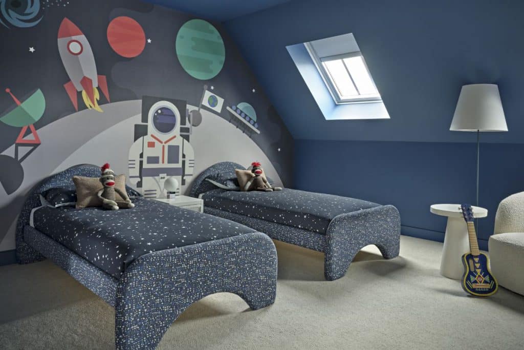 Astronaut space themed boys twin bedroom.