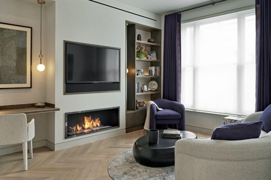 Elegant London living room with bespoke joinery and fireplace.