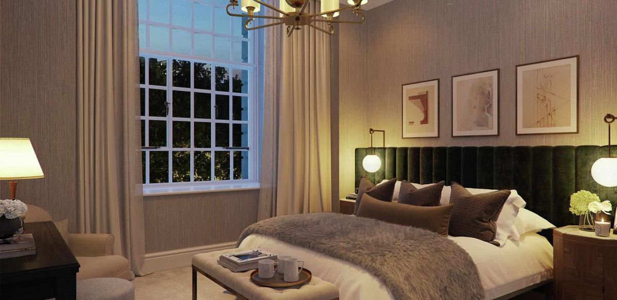 An image of a luxury bedroom at night at 9 Millbank designed by Eric Parry Architects. 