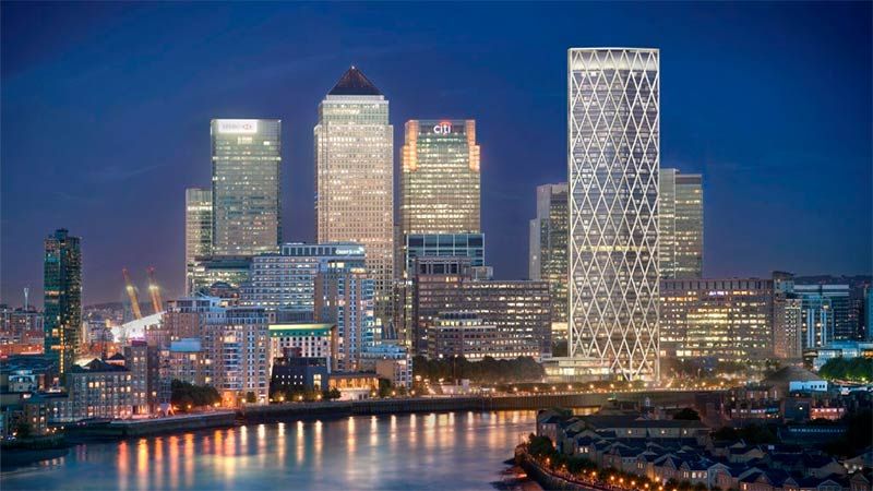 City skyline at night showing Canary Wharf Developments.