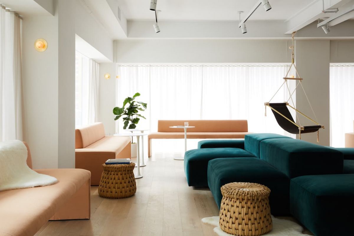 Comfy seating area at womens only work and wellness social club, Maison, in New York. 