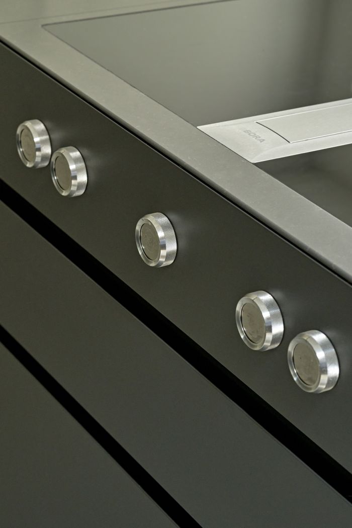 Close up image of a grey sleek Bora professional hob 2.0 on luxury kitchen.