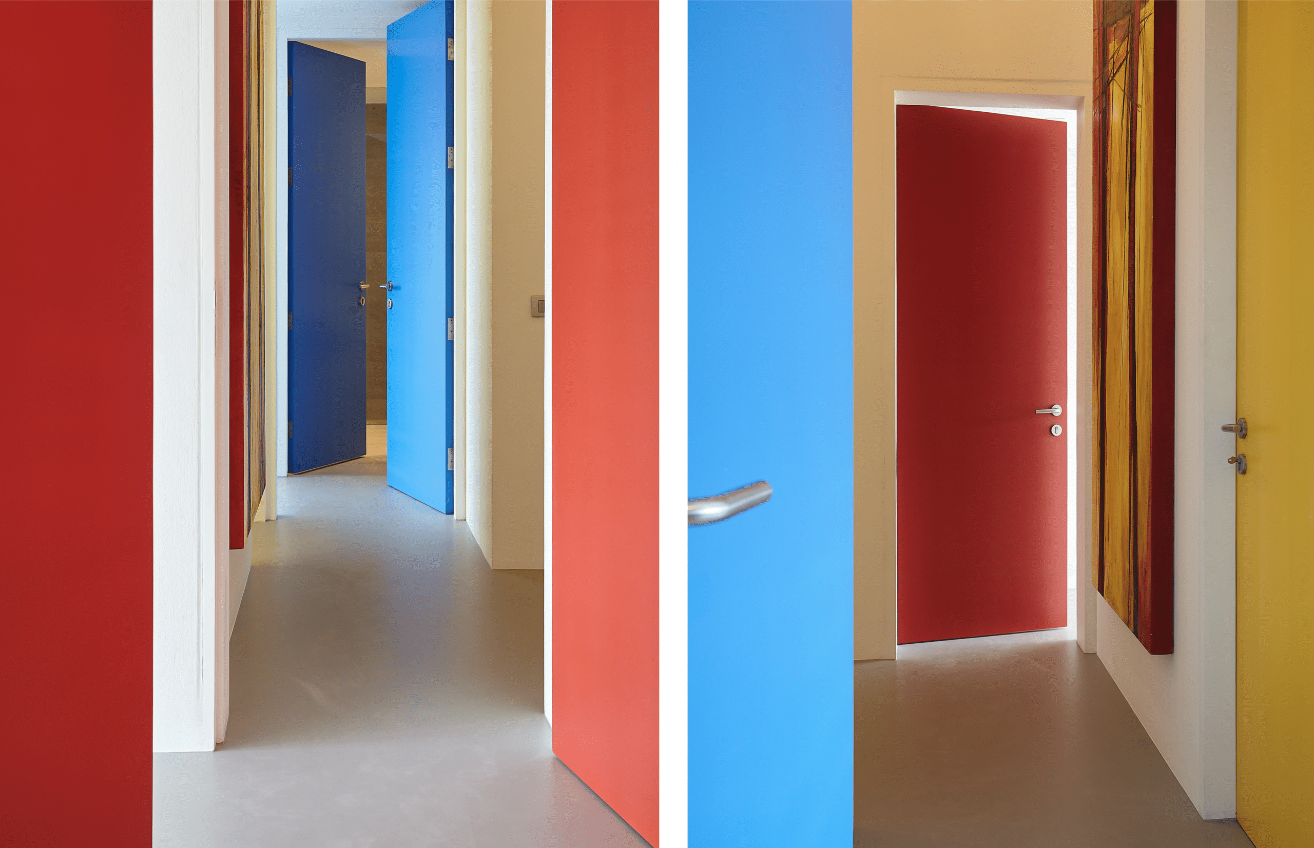 Colourful doors lead to different colour themed bedrooms off the central hallway. 