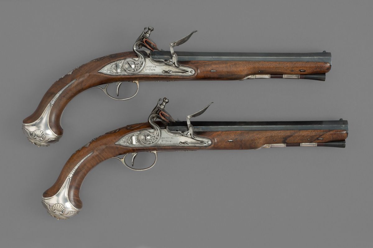 An Exceptional Pair of English Silver-Mounted Flintlock Duelling Pistols, by Griffin & Tow, London, London Silver Hallmarks for 1775.