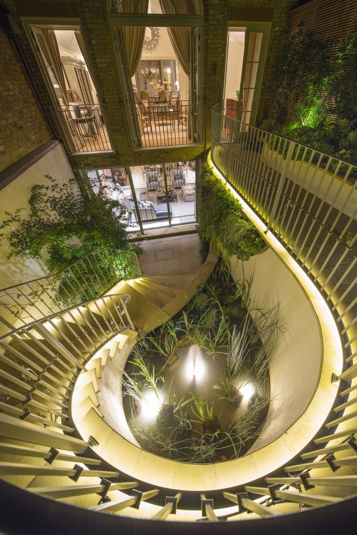 London garden terrace with lights at night. 