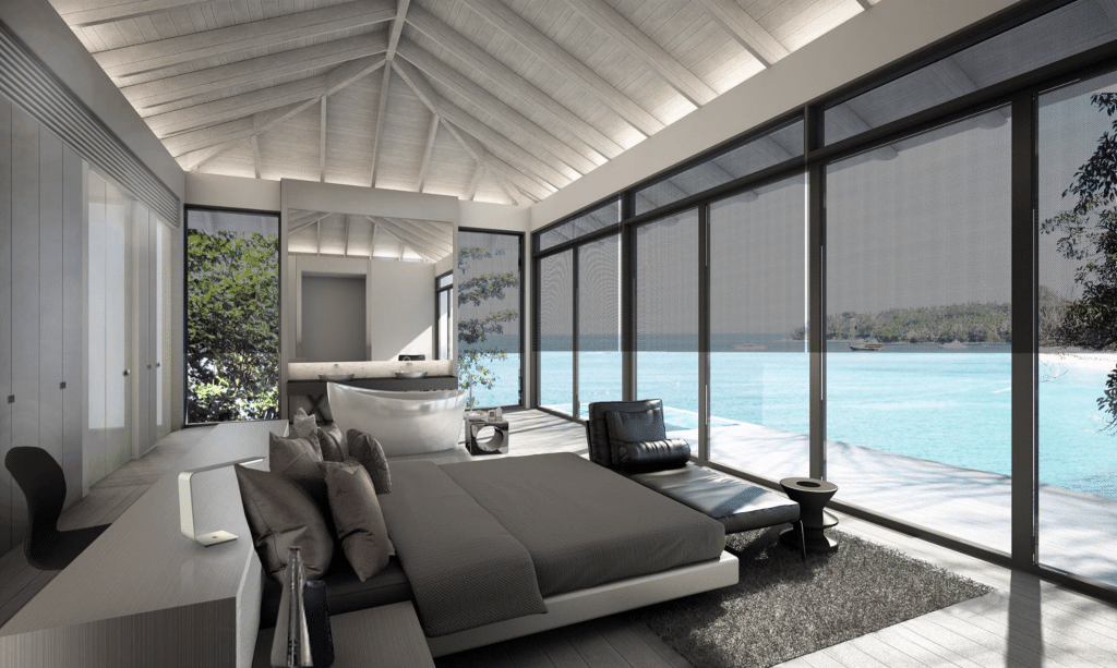Master bedroom with floor to ceiling windows in a suite design.