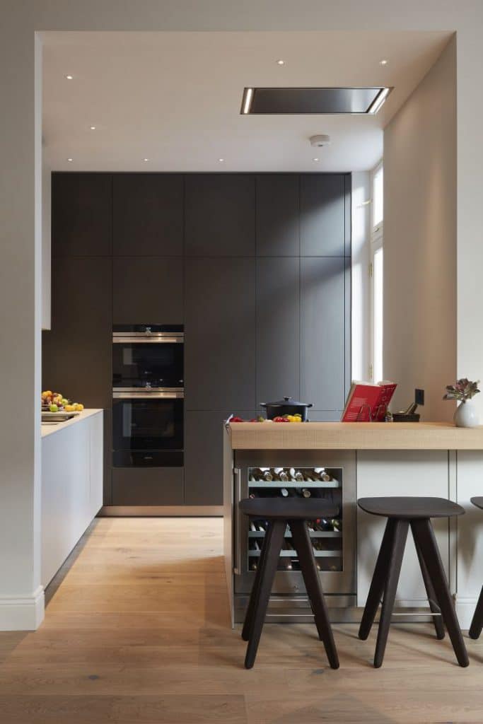 Bulthaup kitchen in gravel and anthracite with oak bar and Poliform ICS stools.