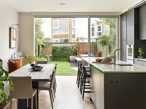 open plan kitchen dining room in London terraced house decorated with botanicals.