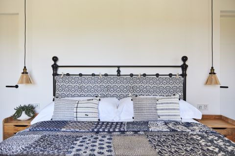 Gaston y Daniela fabric used on pillow for cast iron bedstead.