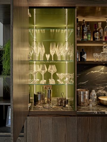 Luxury moody home bar glass storage with internal lights.