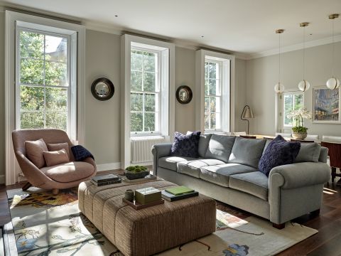A large neutral coloured family living room in period London home in Highbury Crescent.