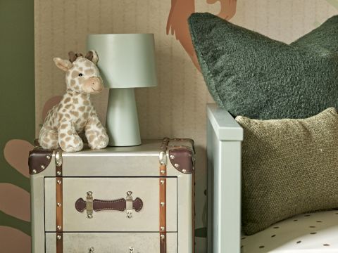 Luxury kids playroom with jungle wallpaper and explore steamer chests as bedside lockers.