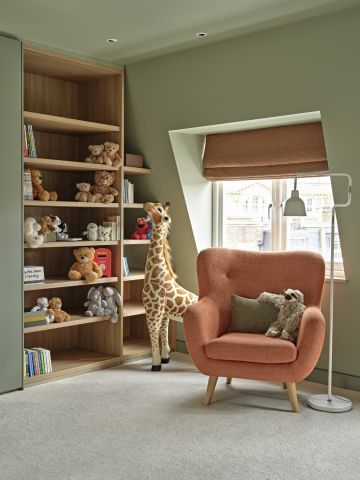 Reading area in a kids playroom and bedroom with children's library.
