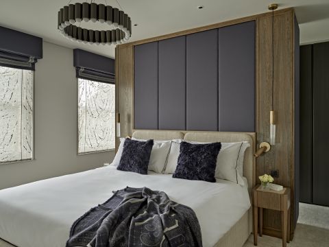 Classic contemporary bedroom with neutral and blue tones