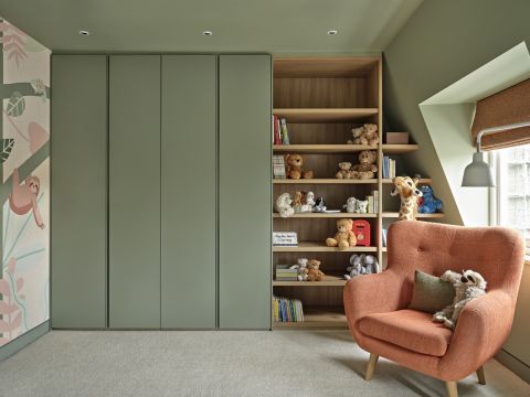 green and neutral kids playroom and library.