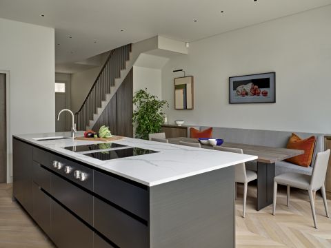 Open plan simple and neutral kitchen area.