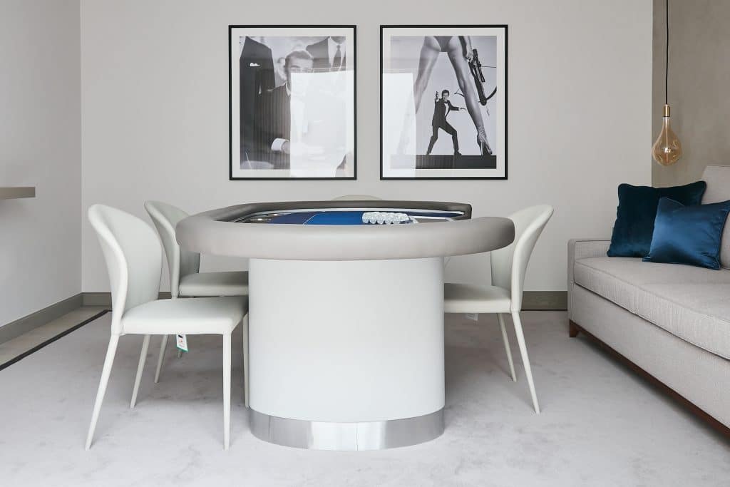 Neutral playroom with poker table in the center.