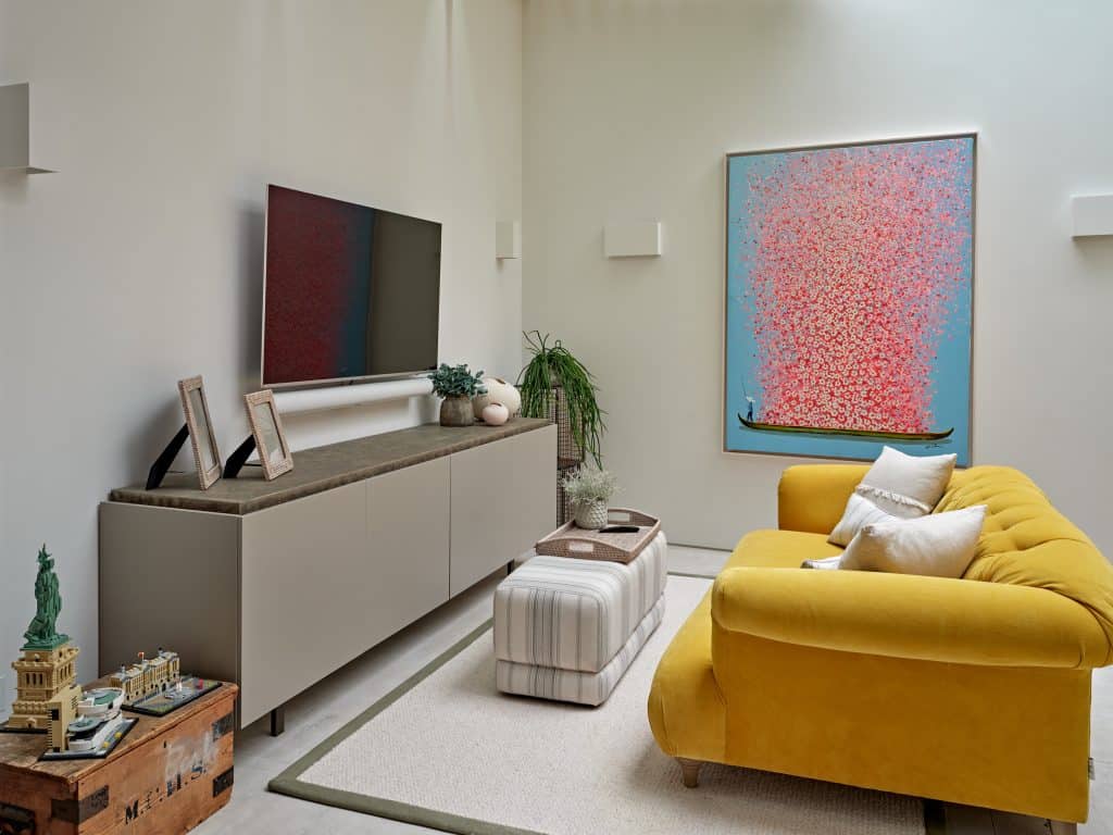 Modern media room with both neutral and bright colours.